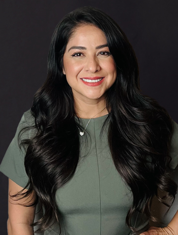 A woman with long black hair posing for a photo.